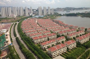 rows of unoccupied houses by a river