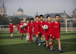 young chinese players line up for match