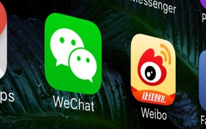WeChat and Weibo displayed on iPhone Screen
