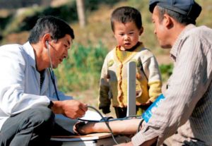 village doctor taking blood pressure in china