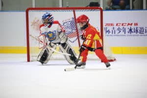 Youngsters play ice hockey in Beijing