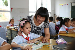 teacher in classroom with children in china