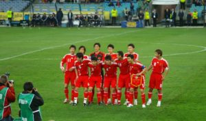 Chinese Invention: Chinese football team on pitch
