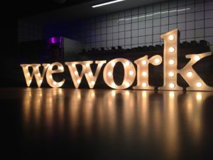 wework logo lit up with lights