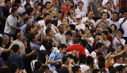 Kobe Bryant surrounded by Chinese fans