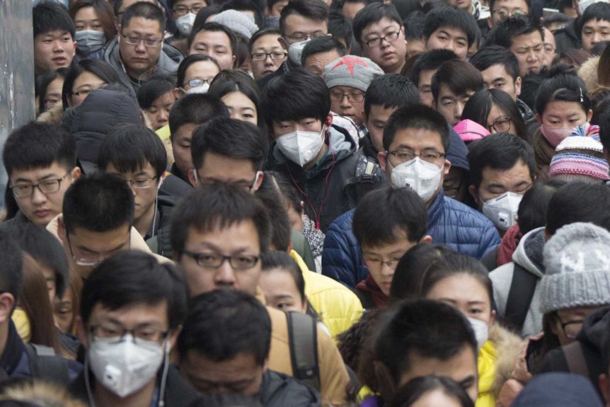 group of people, some wearing masks in china